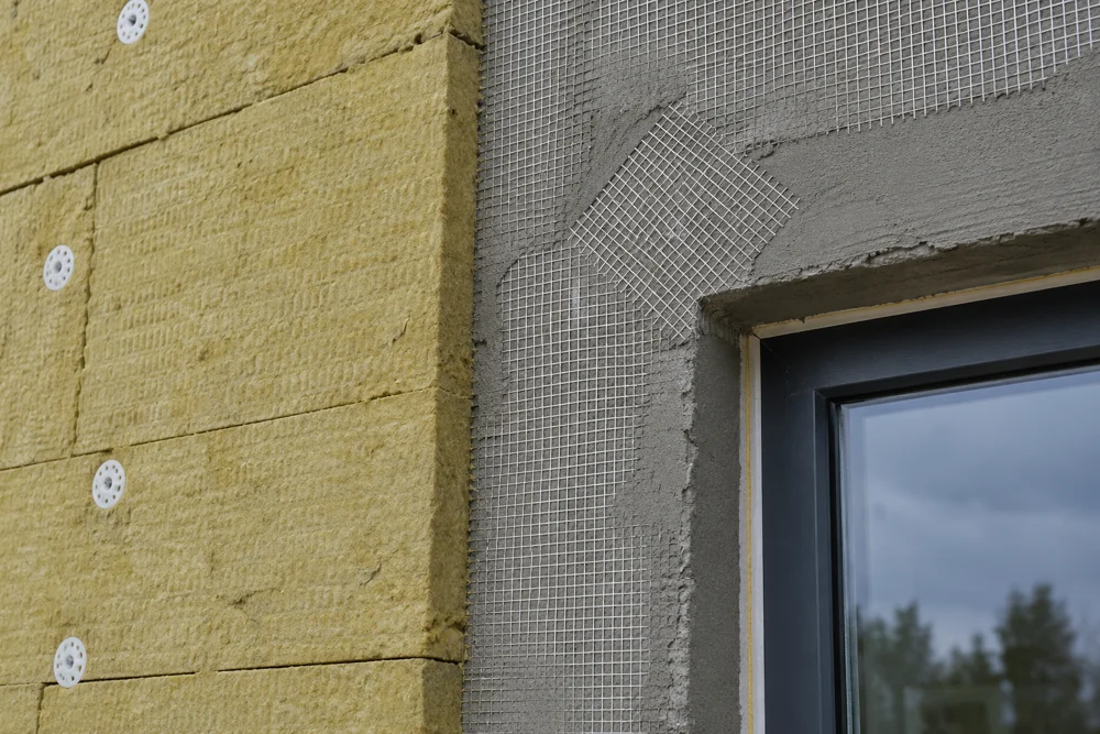 Mineral wool insulation and facade reinforcing layer